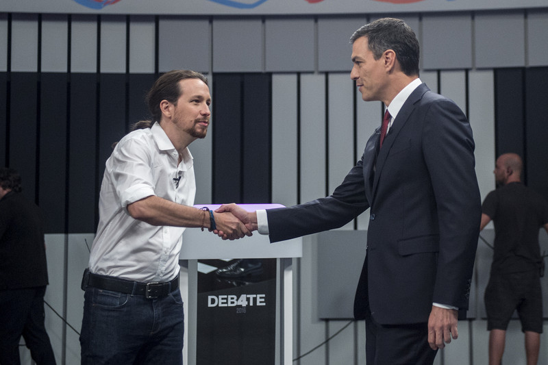 Pedro Sanchez (r) and Pablo Iglesias. The new coalition government has committed to implement reformist policies, including tax rises for higher earners, an increase in the minimum wage and labour reforms (Photo: Podemos)